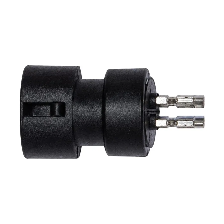 Cylindrical moulded terminal connector body carrying metal blade terminals